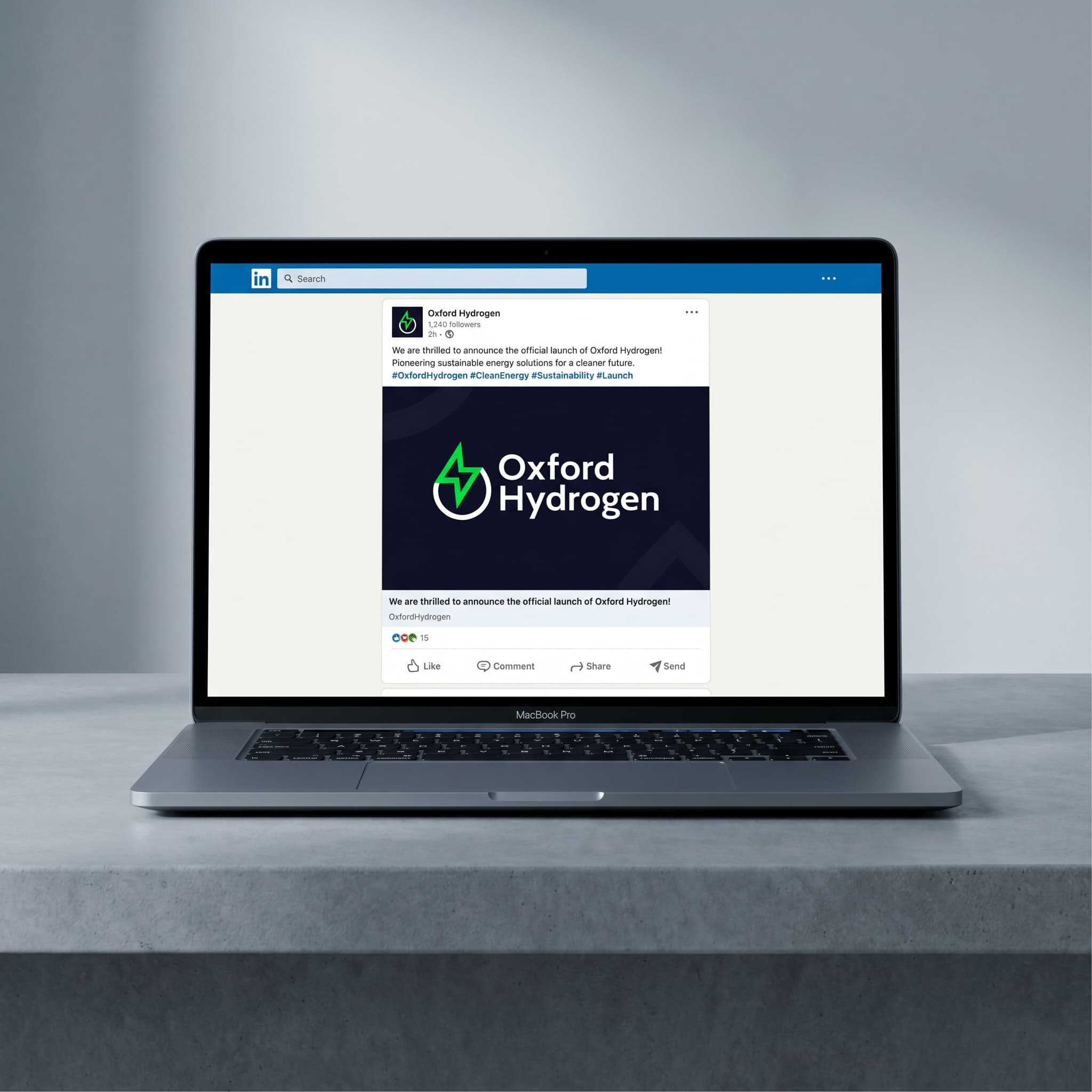 A laptop displaying a mock up of how the new logo looks on a social media post